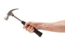 Man beats wife, son with hammer