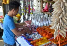 Buy only quality-certified firecrackers, says DTI A firecracker vendor in Tigbauan, Iloilo attends to his goods on Dec. 26. Firecrackers can only be sold in designated zones set by the local government unit in coordination with the Philippine National Police and the Bureau of Fire Protection. PN