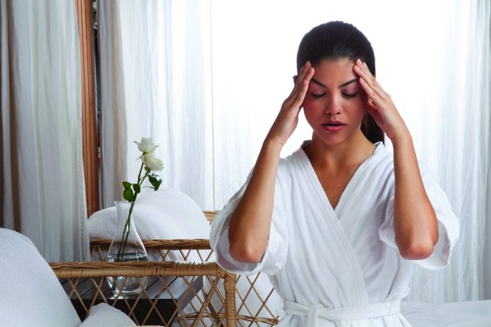 Young Woman Massaging her Face