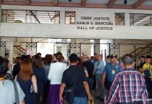 Who made the bomb threat at Hall of Justice?