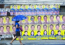 Campaign period for local candidates starts today A women passes by campaign posters in this photo dated March 4, 2019. JACOB MAENTZ