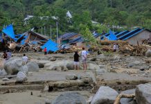 Indonesia’s Papua set for mass burial as flood death toll tops 100