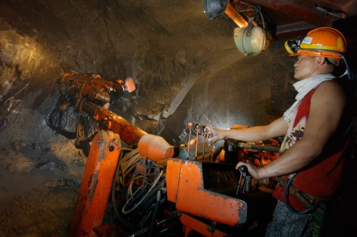 Photo for representation only. A Filipino miner uses a drill machine before blasting to extract boulders of ore in a mine tunnel some 700 meters (2,297 feet) under Mt. Santo Tomas in northern Benguet province. AFP