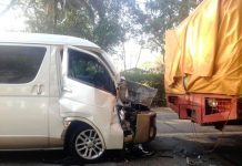 Van hits parked truck