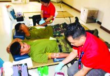 Men of the 61st Infantry Battalion of the Philippine Army participate in a bloodletting activity conducted at the Dr. Ricardo S. Provido Sr. Memorial District Hospital in Calinog, Iloilo in April. 61ST INFANTRY BATTALION