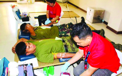 Men of the 61st Infantry Battalion of the Philippine Army participate in a bloodletting activity conducted at the Dr. Ricardo S. Provido Sr. Memorial District Hospital in Calinog, Iloilo in April. 61ST INFANTRY BATTALION