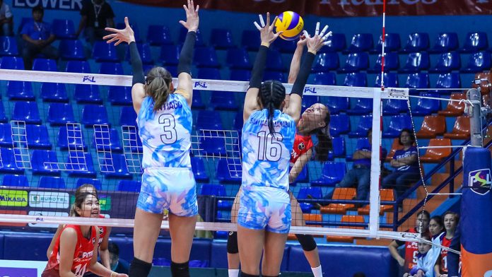 Cherry Rondina Petron Blaze Spikers’ Cherry Rondina directs her shot to the defense of Foton Tornadoes’ Dindin Santiago-Manabat. PSL