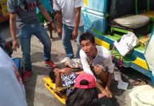 8 injured in Dumangas road crash COLLISSION. This man helps a lady who got injured when a passenger jeepney crashed against a car on the coastal road in Barangay Dacutan, Dumangas, Iloilo on Tuesday afternoon, June 25. IAN PAUL CORDERO/PN
