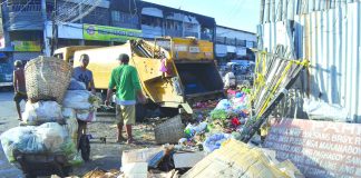 Commissioned personnel collect garbage at the Iloilo Terminal Market in Iloilo City. The Ecological Solid Waste Management Act of 2000 mandates local government units to adopt a systematic, comprehensive and ecological solid waste management program in their areas. IAN PAUL CORDERO