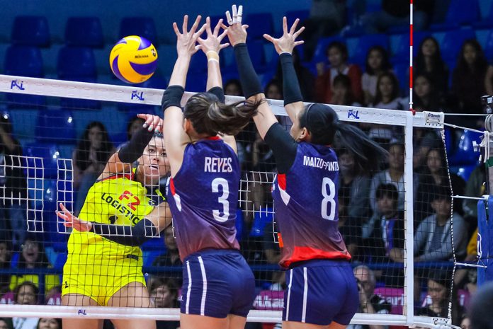 Kalei Mau F2 Logistics Cargo Movers’ Kalei Mau attempts to score over the defense of Petron Blaze Spikers’ Mika Reyes and Aiza Maizo-Pontillas. PSL PHOTO