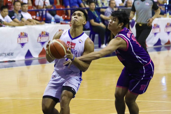 Thirdy Ravena Ilonggo Ferdinand “Thirdy” Ravena III of Cignal HD-Ateneo Blue Eagles gets held down by a Centro Escolar University Scorpions defender as he attempts for a layup. PBA