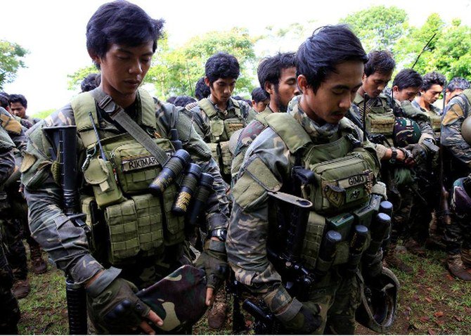 Two suicide bombers Two suicide bombers are seen as behind the bombings at a military camp in Indanan, Sulu, which killed three soldiers and wounded 12 others on Friday. REUTERS