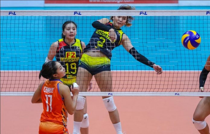 Abigail Marano of F2 Logistics Cargo Movers Abigail Marano of F2 Logistics Cargo Movers fires one over the defense of fellow Ilongga Fiola Ceballos of Generika-Ayala Lifesavers. PSL PHOTO