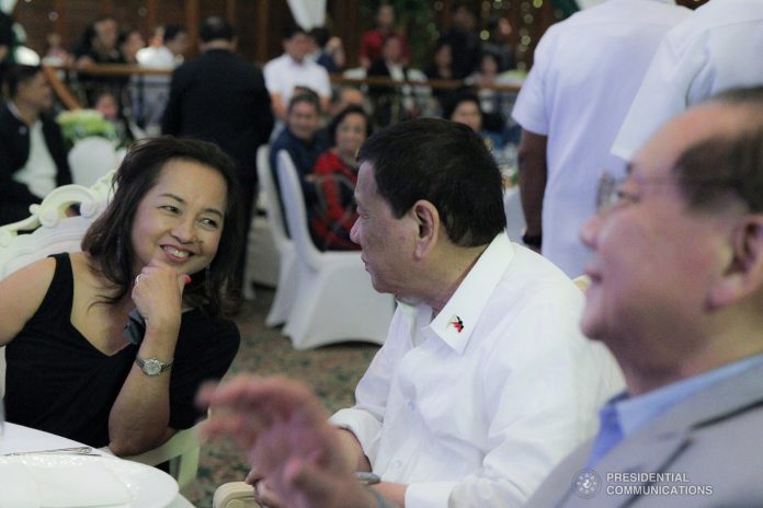 Arroyo Duterte President Rodrigo Roa Duterte shares a light moment with House Speaker Gloria Macapagal-Arroyo during the appreciation dinner for the House Speaker at The Manila Hotel on July 9, 2019. PRESIDENTIAL PHOTO