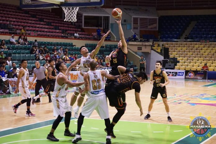 Bacolod Master Sardines Mark Tallo fearlessly scores against three Davao Occidental Tigers defenders. MPBL PHOTO