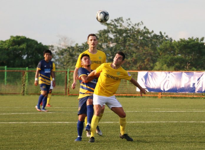 Bienvenido Marañon Ceres-Negros FC’s Bienvenido Marañon fights with a Global-Cebu FC player for a loose ball during their June 1, 2019 match. PFL PHOTO
