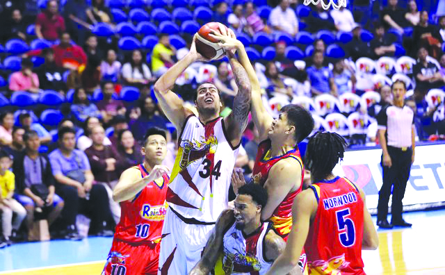 San Miguel Beermen Christian Standhardinger’s shot is foiled by Rain or Shine Elasto Painters’ Jewel Ponferrada. PBA PHOTO