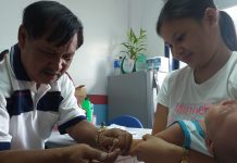 WANTED: MORE DOCS, NURSES DENGUE TEST. Volunteer medical technologist Buenaventura Mainar Jr. extracts a blood specimen from a baby at the rural health unit of Cabatuan, Iloilo. The mother wants to find out if her baby has dengue. Cabatuan has 256 dengue cases with one death, data from the Provincial Health Office of Iloilo show. The province is under a state of calamity due to a dengue outbreak. IME SORNITO/PN