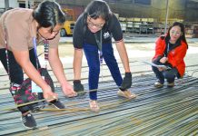 NO TO QUALITY COMPROMISE Commissioned personnel of the Department of Trade and Industry inspect these steel bars at a random hardware shop in Iloilo City on Friday, July 5. DTI REGION 6
