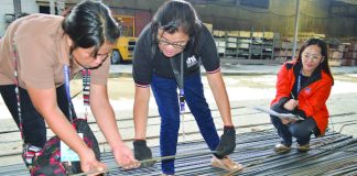 Commissioned personnel of the Department of Trade and Industry inspect these steel bars at a random hardware shop in Iloilo City on Friday, July 5. DTI REGION 6