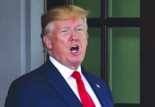 US warship destroys Iranian drone President Donald Trump calls to the media as he waits to greet Dutch Prime Minister Mark Rutte as he arrives at the White House in Washington, Thursday, July 18, 2019. AP
