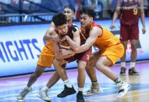 Ilonggo Edgar Charcos of University of Perpetual Help Altas protects the ball after being hounded by two Mapua University Cardinals defenders. ABS-CBN SPORTS