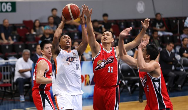 Elvin Jake Pascual Alaska Aces’ Elvin Jake Pascual attempts to foil the shot of Meralco Bolts’ Chris Newsome. PBA PHOTO