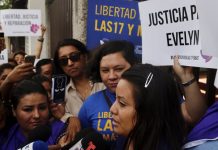 Salvadoran accused of abortion faces hefty sentence Evelyn Beatriz Hernandez, front, walks past protestors supporting her as she arrives at court in San Salvador, El Salvador, Monday, July 15, 2019. The young woman who birthed a baby into a toilet in faces a second trial for murder after having already served 33 months. AP