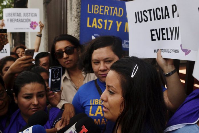 Evelyn Beatriz Hernandez Evelyn Beatriz Hernandez, front, walks past protestors supporting her as she arrives at court in San Salvador, El Salvador, Monday, July 15, 2019. The young woman who birthed a baby into a toilet in faces a second trial for murder after having already served 33 months. AP