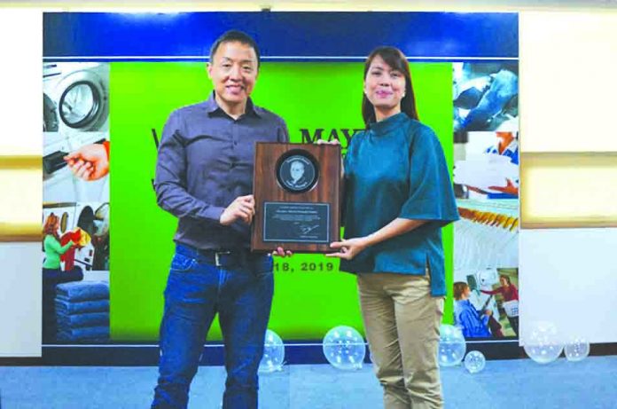 Fred Maytag Award The prestigious Fred Maytag Award for outstanding achievement with Mr. John Sioco, (left) operations director and Ms. Windy Punzalan, (right) brand manager.