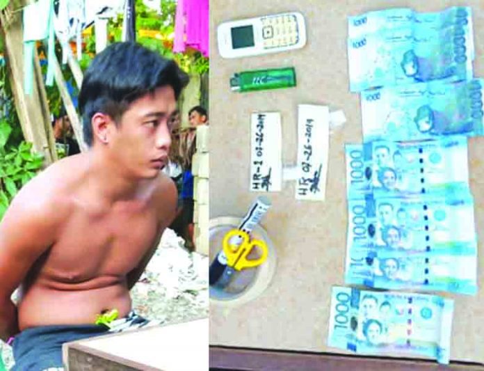 Hilberto Reyes Construction worker Hilberto Reyes sits handcuffed after policemen caught him in an entrapment operation in Barangay Poblacion, Numancia, Aklan on July 26. Recovered from his possession were P8,000 marked money and a cellphone. RODNEL AGUIRRE VIA AKEAN FORUM