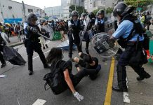 Hong Kong protesters storm legislature in fresh chaos Riot police try to disperse protesters near a flag raising ceremony for the anniversary of Hong Kong handover to China in Hong Kong, China July 1, 2019. REUTERS