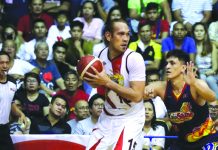 San Miguel Beermen’s June Mar Fajardo protects the leather as Rain or Shine Elasto Painters’ Jewel Ponferrada anticipates a steal. PBA