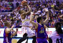 Barangay Ginebra San Miguel Kings’ Justin Brownlee mauls the defense of Magnolia Hotshots for an inside hit. PBA