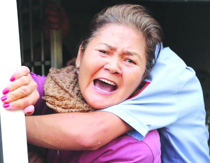 Kazakh protesters arrested at rallies A woman reacts inside a police minibus after she was detained during a protest rally held by Kazakh opposition supporters in Almaty, Kazakhstan July 6, 2019. REUTERS