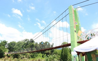 SAFE PATH. Residents of Barangay Agsirab, Lambunao Iloilo are assured of safety, especially during rainy season, with the completion of the 127-meter hanging bridge. The project funded by the Kapit Bisig Laban sa Kahirapan – Comprehensive and Integrated Delivery of Social Services National Community Demand Driven Program with counterpart funds from the barangay and municipal governments was inaugurated on Wednesday (July 10, 2019). (PNA photo by CEC Infocenter Lambunao)
