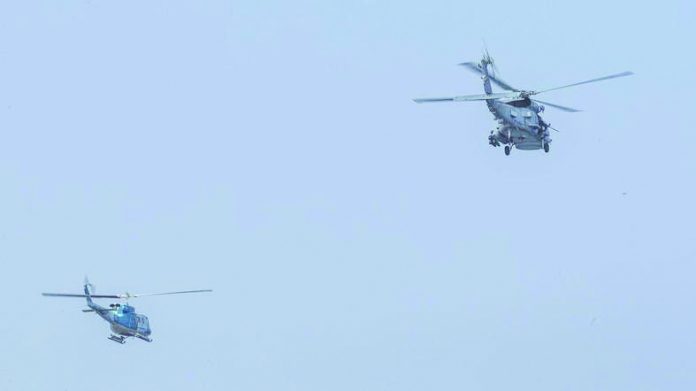 MH-60R Sea Hawk helicopter and Helicopter Maritime Strike Squadron 46 An MH-60R Sea Hawk helicopter with Helicopter Maritime Strike Squadron 46 flies next to an Iranian helicopter during USS aircraft carrier The Boxer transit, through Strait of Hormuz in the Gulf of Oman. AFP