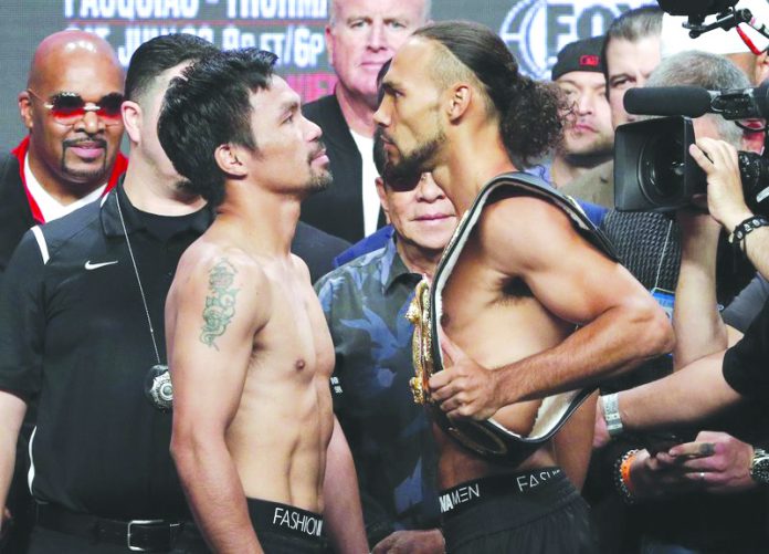 Manny Pacquiao and Keith Thurman WHO WILL BLINK FIRST? Manny Pacquiao and Keith Thurman stare at each other after their weigh in yesterday in Las Vegas, Nevada, USA. AP