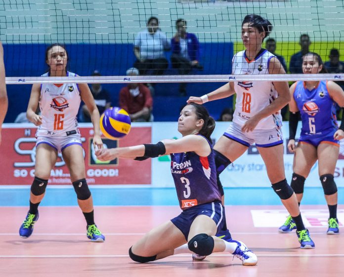 Mika Reyes of Petron Blaze Spikers Mika Reyes of Petron Blaze Spikers digs the ball sent by Generika-Ayala Lifesavers. PSL