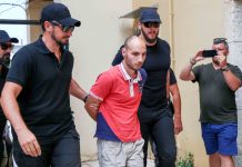Greek man confesses to rape, murder of US scientist Police officers escort the suspect who raped and murdered an American scientist found in cave in Greece. WASHINGTON POST