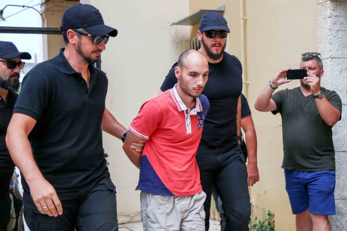 Plain-clothes police officers escort the suspect for the murder of American biologist Suzanne Eaton to the prosecutor in Chania, on the island of Crete Police officers escort the suspect who raped and murdered an American scientist found in cave in Greece. WASHINGTON POST