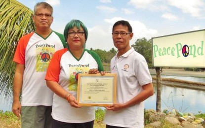 Negrense farmer shortlisted for national achievers’ award Negrense organic farmer Jesus Antonio Orbida (left) with his wife Checcs – founders of the PeacePond in Binalbagan, Negros Occidental – receive a certificate of accreditation issued by the Department of Tourism-Western Visayas. PNA