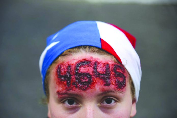Nicole Diaz Nicole Diaz wears special effects make-up with hurricane Maria’s death toll number written on her forehead, while protesting against Governor Ricardo Rossello, in San Juan, Puerto Rico, Friday, July 19, 2019.
