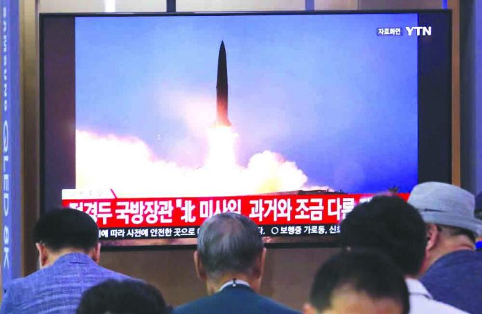 People watch a TV showing a file image of North Korea's missile launch during a news program at the Seoul Railway Station in Seoul, South Korea, Wednesday, July 31, 2019. AP