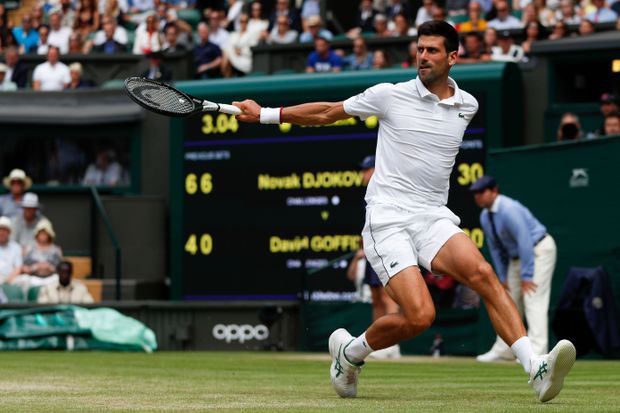 Serbia’s Novak Djokovic returns against Belgium’s David Goffin during their men’s singles quarterfinals match of the 2019 Wimbledon Championships at The All England Lawn Tennis Club in Wimbledon, London, July 10. AFP/GETTY IMAGES