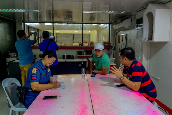 Police officers on July 27 conducted a nationwide crackdown on all gaming schemes operated by the Philippine Charity Sweepstakes Office as per directive of President Rodrigo Duterte. IAN PAUL CORDER/PN