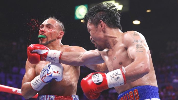 Pacquiao Thurman BIG BLOW. Keith Thurman connects with a shot to the face of Manny Pacquiao during Round 6 of their WBA super welterweight world championship fight in the MGM Grand Garden Arena in Las Vegas, Nevada, USA. L.E. BASKOW, LAS VEGAS REVIEW-JOURNAL