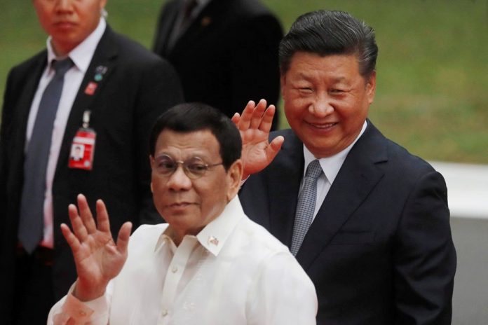 President Rodrigo Duterte (front) and Chinese President Xi Jinping’s verbal agreement allowing Chinese fishermen to trawl within the Philippine exclusive economic zone is “legally binding,” according to Presidential Spokesman Salvador Panelo. ABS-CBN NEWS