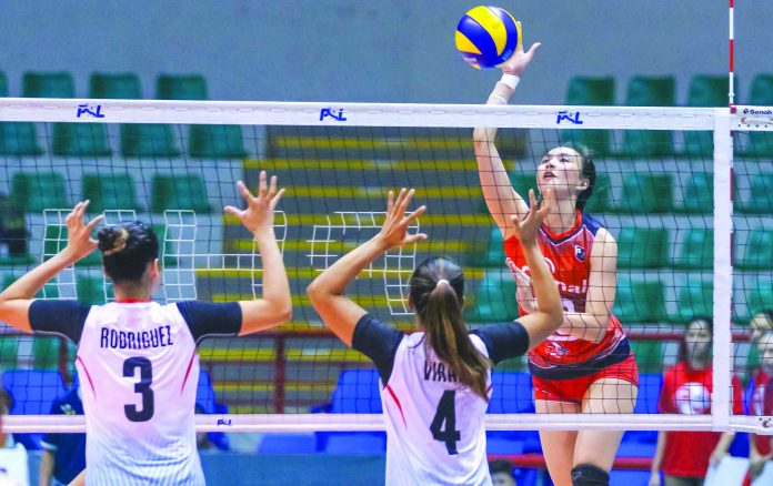 Rachel Anne Daquis Rachel Anne Daquis of Cignal HD Spikers scores against the defense of Marinerang Pilipina Lady Skippers’ Seth Rodriguez and Caitlyn Viray. PSL
