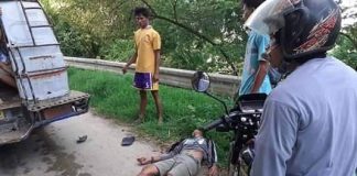 Reynaldo Camral lies lifeless on the ground after falling from the roof of a public utility jeepney on July 11. KISS FM 96.3 LEON